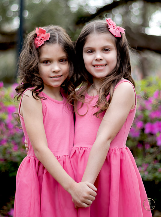 Charleston Wedding Photographer image of 2 flower girls making a heart shape with their posing