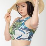 teen girl poses in studio with sun hat