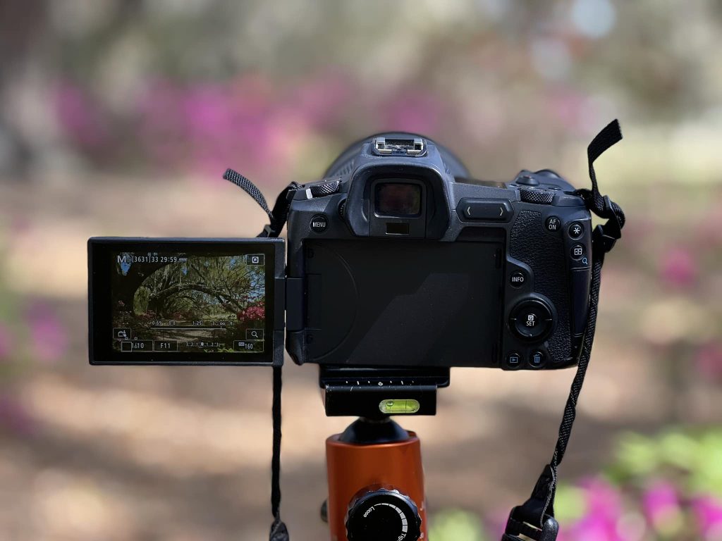Digital camera in front of a beautiful landscape