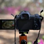 Digital camera in front of a beautiful landscape