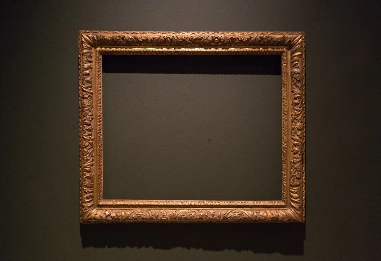 Empty picture frame hanging on a wall