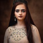 Fine art studio portrait of a girl wearing a black diamond tiara