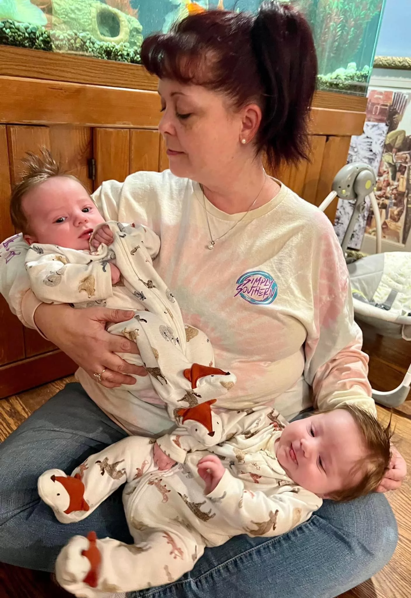 tonya brisson holding twin grandson infants