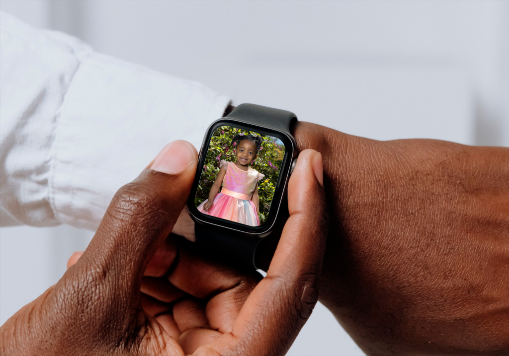 Image of a man looking at a photo on his smart watch